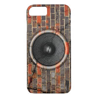 Music speaker on a cracked brick wall