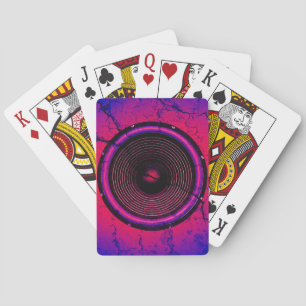 Music speaker on a cracked wall playing cards