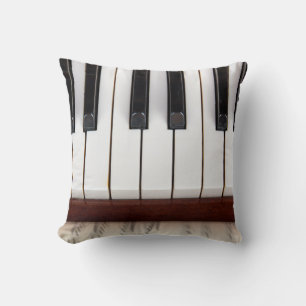 musical notes on the background of a pianoacoustic cushion