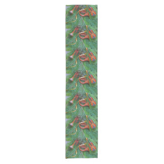 Musical ornaments on greenery short table runner