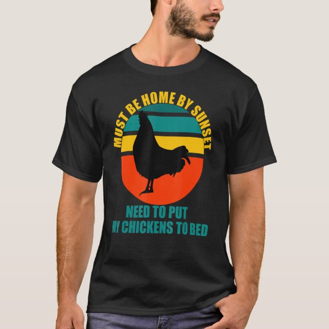 Must be home by sunset Chickens need to be put to  T-Shirt (Front)