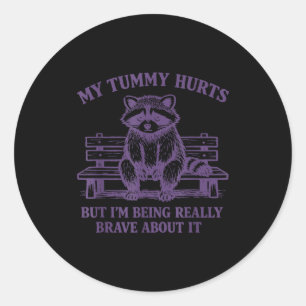 My tummy hurts but i'm being brave about it raccoo classic round sticker