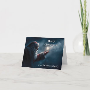 Mysterious Santa Claus Blowing a Glowing Snowflake Holiday Card