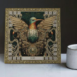 Mystical Hummingbird Tribal Jewel Tribute Tile<br><div class="desc">Step into a realm where the physical and spiritual converge with our meticulously crafted 'Mystical Hummingbird Tribal Jewel Ceramic Tile'. Inspired by an amalgamation of unique art styles - tribal aesthetics, happycore optimism, carpet punk rebellion, and symmetrical harmony, this tile resonates with a rich visual narrative. The core motif features...</div>