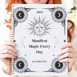 Mystical Sun and Moon Custom Name Manifestation  Planner<br><div class="desc">This magical design features intricate celestial elements, including the sun, moon, and stars, paired with detailed sunflower illustrations in a classic black-and-white palette. The empowering phrase "Manifest Magic Every Day" adds inspiration and intention to your daily organisation. Personalised with a custom name and year, this design is perfect for astrology...</div>