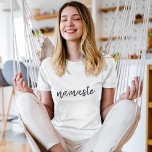 Namaste | Modern Spiritual Meditation Yoga T-Shirt<br><div class="desc">Simple, stylish "namaste" quote art design in modern minimalist handwritten script typography. The slogan can easily be personalised with your own words for a perfect gift for a yoga bunny or pilates lover! Namasté literally means "greetings to you." In the Vedas, namaste mostly occurs as a salutation to a divinity....</div>