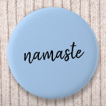 Namasté | Pastel Blue Yoga Spiritual Salutation 6 Cm Round Badge<br><div class="desc">Simple, stylish "namaste" quote art design in modern minimalist handwritten script typography on a pastel blue background. The slogan can easily be personalized with your own words for a perfect gift for a yoga bunny or pilates lover! Namasté literally means "greetings to you." In the Vedas, namaste mostly occurs as...</div>