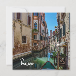 Narrow street with canal in Venice