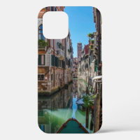 Narrow street with canal in Venice