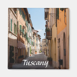 Narrow street with old facades in tuscany village magnet