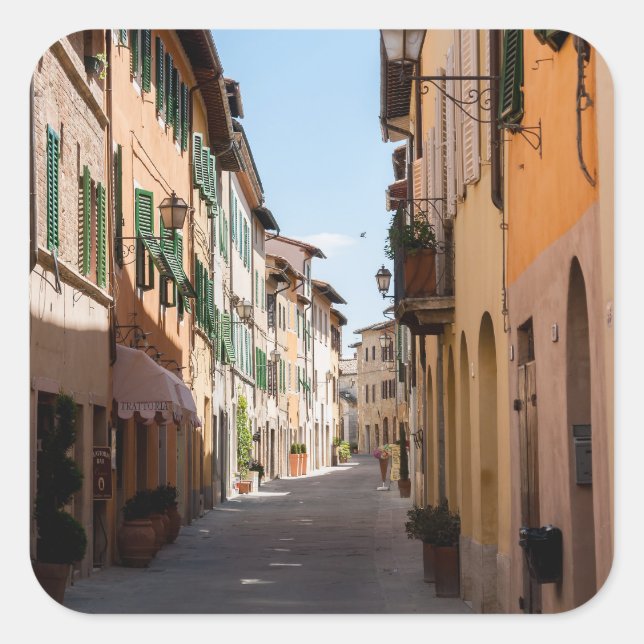 Narrow street with old facades in tuscany village square sticker (Front)