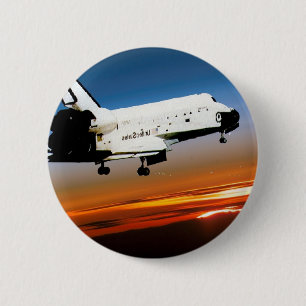 NASA SPACE SHUTTLE FLYING INTO COCOA BEACH 6 CM ROUND BADGE