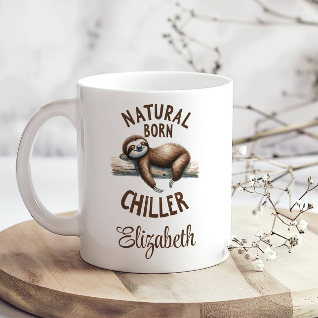 "Natural Born Chiller" Cute Sloth & Script Name Coffee Mug ("Natural Born Chiller" Cute Sloth & Script Name Coffee Mug on a boho kitchen table with tiny flowers)