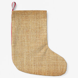 Natural sackcloth, textured background. small christmas stocking