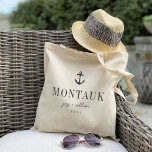 Nautical Anchor Destination Wedding Welcome Tote Bag<br><div class="desc">Welcome guests to your destination wedding with these chic and modern personalised tote bags. Design features a nautical anchor illustration in dark navy blue with your wedding destination beneath (shown with Montauk, New York) in classic serif lettering. Add your names beneath in handwritten cursive script, as well as the year....</div>