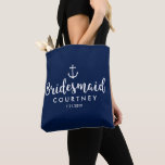 Nautical Anchor Wedding Personalised Bridesmaid Tote Bag<br><div class="desc">Surprise your bridesmaids with this personalised tote bag featuring a nautical design with a white anchor set against a navy background. Customise by adding her name and your wedding date. A great size for wedding essentials: make-up, extra shoes and clothing, water, etc. The perfect go-to bag for a nautical, beach...</div>