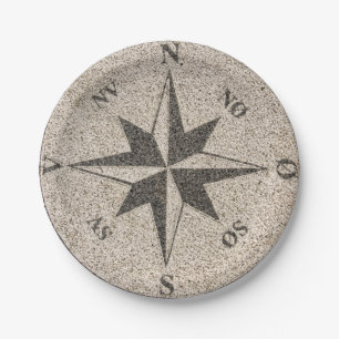 Nautical compass rose on grey granite paper plate