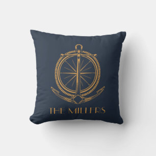 Nautical design with gold compass and anchor cushion