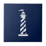 Nautical Lighthouse Ceramic Tile<br><div class="desc">White lighthouse on navy blue ceramic tile. Perfect nautical decor for bathroom and kitchen. For all sailors and everyone who loves nautical,  Hamptons,  New England and Nantucket style.</div>