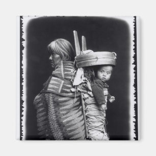 Navaho woman carrying a papoose on her back magnet