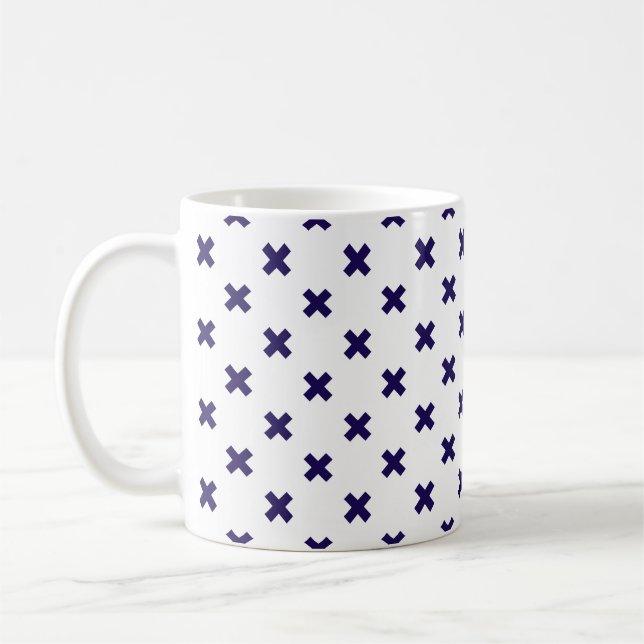 Navy blue cross stitches on white coffee mug (Left)