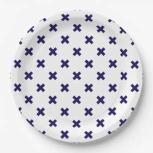 Navy blue cross stitches on white paper plate