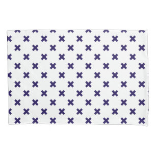 Navy blue cross stitches on white pillowcase