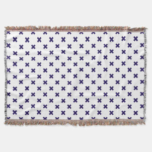 Navy blue cross stitches on white throw blanket