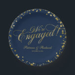 Navy Blue Gold We're Engaged Engagement Party Paper Plate<br><div class="desc">Elegant calligraphy engagement party paper plate. Easy to personalise with your details. Please get in touch with me via chat if you have questions about the artwork or need customisation. PLEASE NOTE: For assistance on orders,  shipping,  product information,  etc.,  contact Zazzle Customer Care directly https://help.zazzle.com/hc/en-us/articles/221463567-How-Do-I-Contact-Zazzle-Customer-Support-.</div>