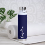 Navy Blue Personalised Wedding Bridesmaid Water Bottle<br><div class="desc">Gift your wedding bridesmaid or maid of honour with this vacuum trendy, insulated water bottle that features her name in white, stylised script on a navy blue colour background designed to match your wedding colour scheme. Personalise bottle by editing and replacing name with your own as desired. Select your water...</div>