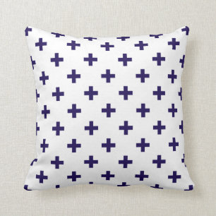 Navy blue polka crosses on white cushion
