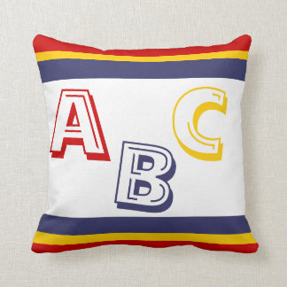 navy blue, yellow, and red ABC on white Cushion