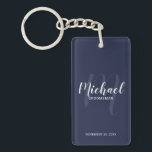 Navy Modern Script Personalised Groomsmen Key Ring<br><div class="desc">Add a personal touch to your wedding with personalised groomsmen keychain. This keychain features personalised groomsmen's name in white modern script font style and monogram in light navy blue modern script font style as background with title and wedding date in white modern sans serif font style on navy blue background....</div>