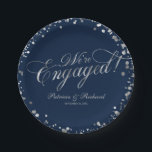 Navy Silver We're Engaged Engagement Party Paper Plate<br><div class="desc">Elegant calligraphy engagement party paper plate. Easy to personalise with your details. Please get in touch with me via chat if you have questions about the artwork or need customisation. PLEASE NOTE: For assistance on orders,  shipping,  product information,  etc.,  contact Zazzle Customer Care directly https://help.zazzle.com/hc/en-us/articles/221463567-How-Do-I-Contact-Zazzle-Customer-Support-.</div>