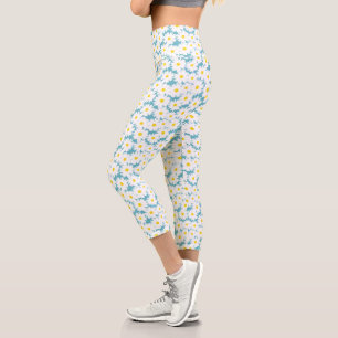 Negative Space Daisies white yellow on blue Capri Leggings