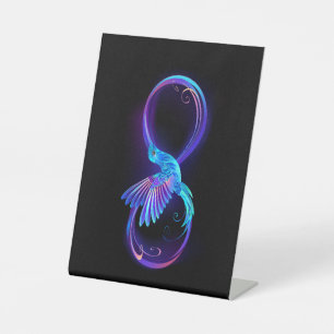 Neon Infinity Symbol with Glowing Hummingbird Pedestal Sign