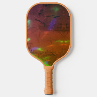 neon lights on cracked rock surface pickleball paddle