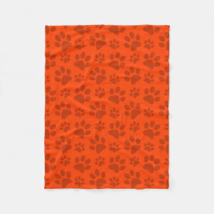Neon orange dog paw print fleece blanket
