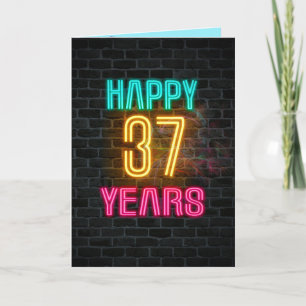 Neon sign on brick for 37th birthday card