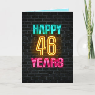 Neon sign on brick for 46th birthday card