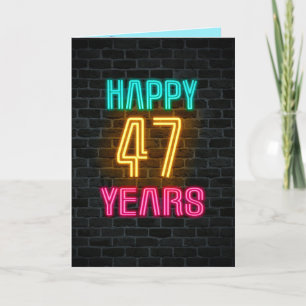 Neon sign on brick for 47th birthday card