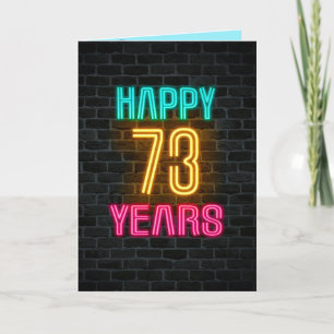 Neon sign on brick for 73rd birthday card