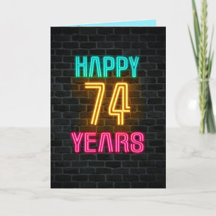 Neon sign on brick for 74th birthday card