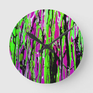Neon Splatter Paint Purple Green and Black Round Clock