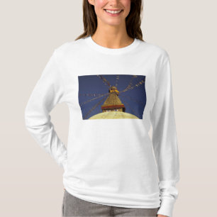 Nepal, Kathmandu. Under prayer flags, watchful T-Shirt