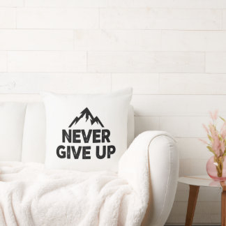 Never give up text with mountain peak cushion
