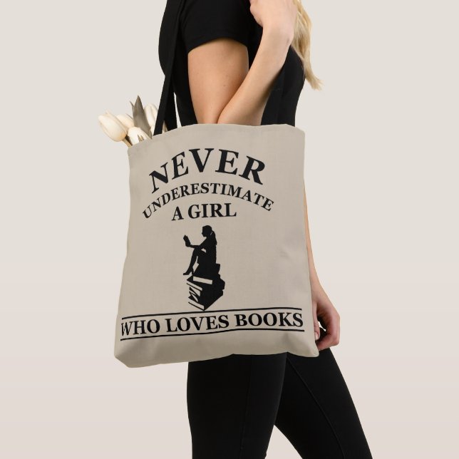never underestimate a girl who loves books tote bag (Close Up)