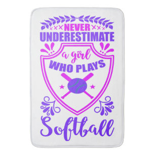 Never Underestimate A Girl Who Plays Softball Bath Mat