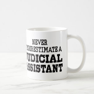Never underestimate a Judicial assistant Coffee Mug