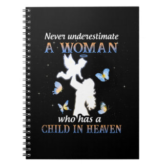 Never underestimate a woman who has a child in hea notebook